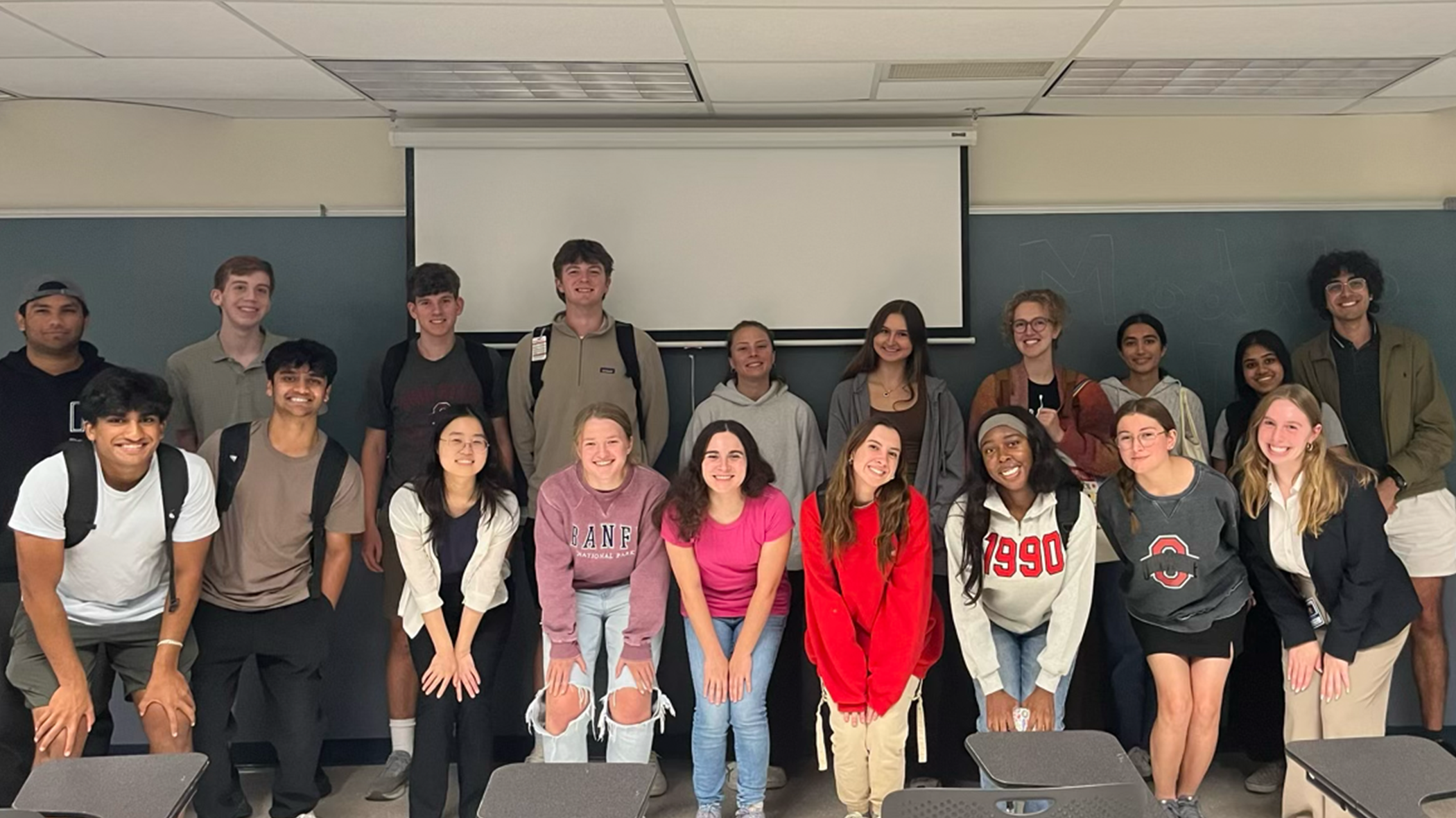 Classroom of 19 students smiling as writers for Grant Central