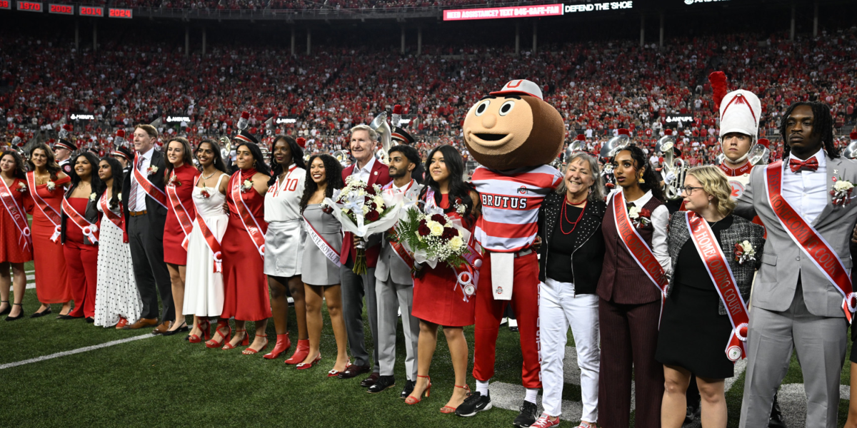 The 2025 Homecoming Court with President Walter “Ted” Carter Jr. at Ohio Stadium.