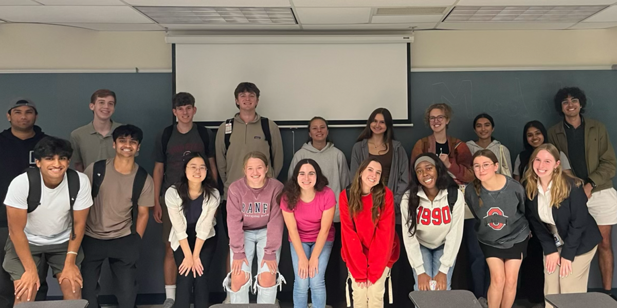 Classroom of 19 students smiling as writers for Grant Central