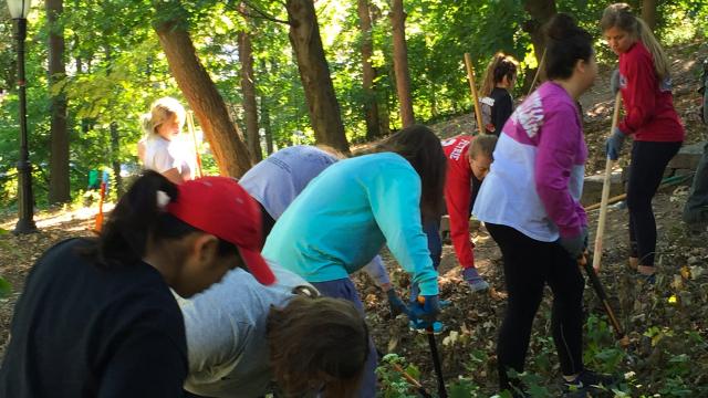 Humanitarian Engineering Scholars students doing community service