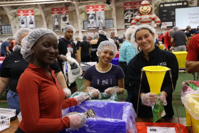 Scholars participating in Ohio State food packing event