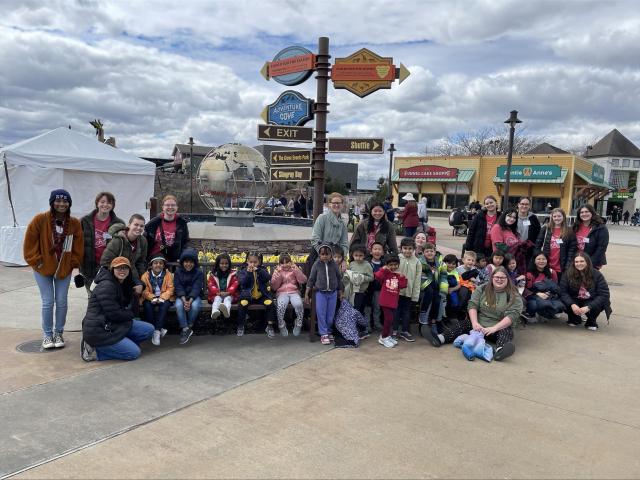 Humanities Scholars posing together outside the Columbus Zoo