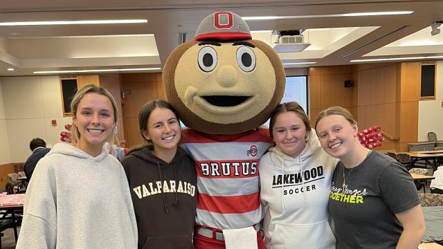 STEM EE Scholars at a community event with Brutus Buckeye