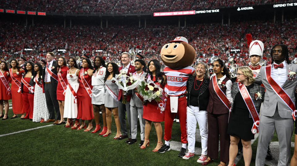 The 2025 Homecoming Court with President Walter “Ted” Carter Jr. at Ohio Stadium.