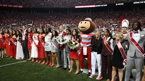 The 2025 Homecoming Court with President Walter “Ted” Carter Jr. at Ohio Stadium.