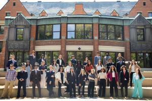 Allison Sachs and Stamps Eminence cohort pose in front of Hale Hall