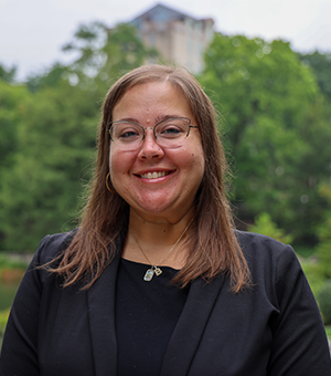Portrait of Brittany Savko with greenery and building in background